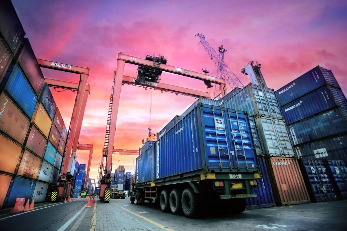 Shipping containers and cranes at a port terminal
