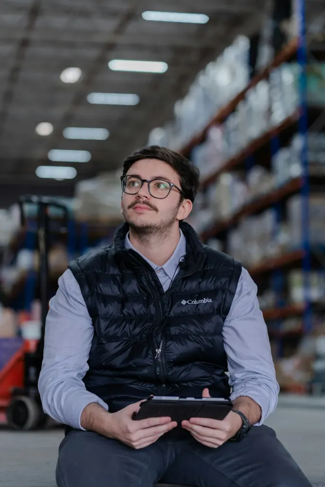 Warehouse operator reviewing inventory data on a tablet